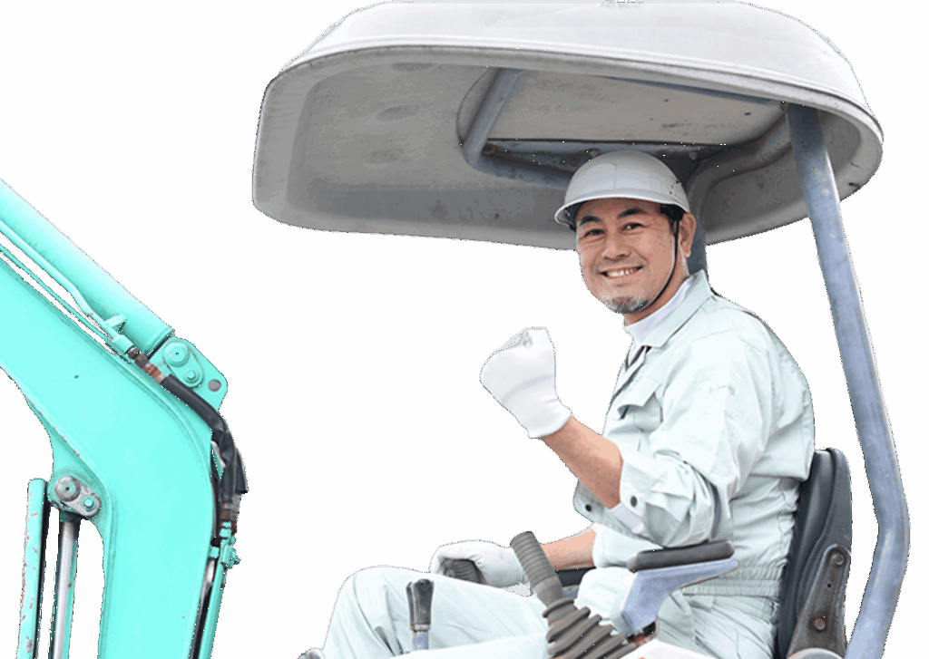 重機に乗り笑顔でガッツポーズをする作業員